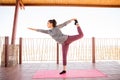 Woman practising the king dancer yoga pose Royalty Free Stock Photo