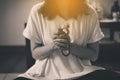Woman prayer hands with beads cross the hands,Women with in praying position,Black and white toned Royalty Free Stock Photo