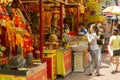 Woman praying at the Buddhist shrine