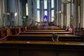 Woman praying in catholic church called Church of St. Anthony of Padua