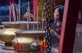 Woman Praying In A Chinese Temple In Kuala Lumpur, Malaysia