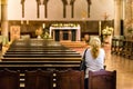 Woman praying in church