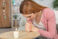 woman praying depressed at home Royalty Free Stock Photo