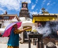 Woman praying in front of the Bouddhanath stupa Royalty Free Stock Photo