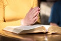 Woman praying with her hands over the bible Royalty Free Stock Photo