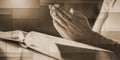 Woman praying with her hands over the bible, geometric pattern Royalty Free Stock Photo