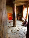 Woman praying in one of the temples at Thiksay Monastery in Leh Ladakh region in Kashmir India Royalty Free Stock Photo