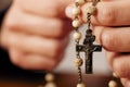 Woman praying with rosary to God Royalty Free Stock Photo