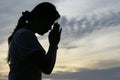 Woman praying silhouette Royalty Free Stock Photo