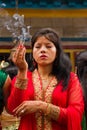 Woman praying at Teej festival, Durbar Square, Kathmandu, Nepal