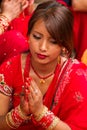 Woman praying at Teej festival, Durbar Square, Kathmandu, Nepal