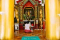 A woman praying in a temple at Shwedagon Pagoda in Yangon. Royalty Free Stock Photo