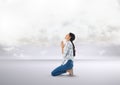 Woman praying under clouds Royalty Free Stock Photo