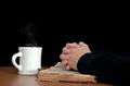 Woman praying on vintage Bible Royalty Free Stock Photo