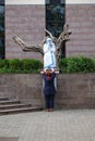 A woman prays in front of the statue of St. Mother Teresa in front of St. Paul`s Cathedral in Tirana, Albania