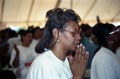 Woman prays fervently at a tent revival in Landover, Maryland Royalty Free Stock Photo