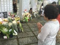 Woman prays for late ex prime minister of Singapore, Lee Kuan Yew