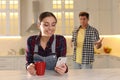 Woman preferring smartphone over spending time with her boyfriend. Jealousy in relationship