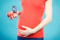 Woman in pregnant with apple and glucose meter with good result sugar level, diabetes and nutrition during pregnancy Royalty Free Stock Photo