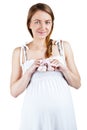 Woman pregnant with a baby holding children's shoes Royalty Free Stock Photo