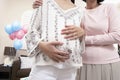Woman With Pregnant Daughter At Baby Shower