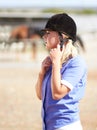 Woman prepare, horse jockey and helmet of young athlete on equestrian training ground for show and race. Outdoor, female Royalty Free Stock Photo