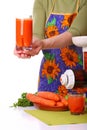 Woman prepare Juice extractor and carrot Royalty Free Stock Photo