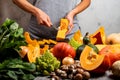 Woman prepare squash for cooking pumpkin dish. Close-up. Royalty Free Stock Photo