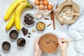 Woman prepares homemade muffins with banana and chocolate Royalty Free Stock Photo