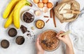 Woman prepares homemade muffins with banana and chocolate Royalty Free Stock Photo