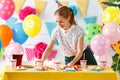 Woman prepares for holiday children`s birthday