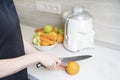 Woman prepares homemade fresh juice Royalty Free Stock Photo