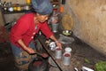 A woman prepares Tongba aka Nepali Beer from fermented millet in a guest house in Bhedetar