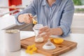 Woman preparing baby formula at table Royalty Free Stock Photo