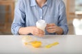 Woman preparing baby formula at table Royalty Free Stock Photo