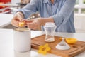 Woman preparing baby formula at table Royalty Free Stock Photo