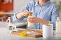 Woman preparing baby formula at table Royalty Free Stock Photo