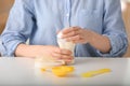 Woman preparing baby formula at table Royalty Free Stock Photo