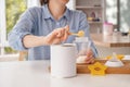 Woman preparing baby formula at table Royalty Free Stock Photo