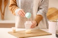 Woman preparing baby milk formula in kitchen Royalty Free Stock Photo