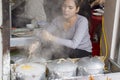 Woman is preparing banh cuon