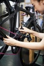 Woman preparing the bike before sale