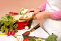 Woman preparing cauliflower fresh vegetable for cooking