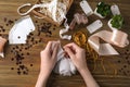 Woman preparing decorations for scrapbooking on wooden background Royalty Free Stock Photo