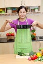 Woman preparing a dish in her kitchen