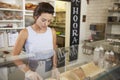 Woman preparing food behind the counter at a sandwich bar Royalty Free Stock Photo