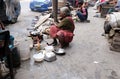 Woman preparing food on street, Kolkata