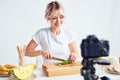 Woman preparing fresh fruit cocktail Royalty Free Stock Photo