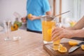 Woman preparing fresh lemon juice in kitchen Royalty Free Stock Photo