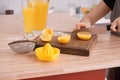 Woman preparing fresh lemon juice in kitchen Royalty Free Stock Photo